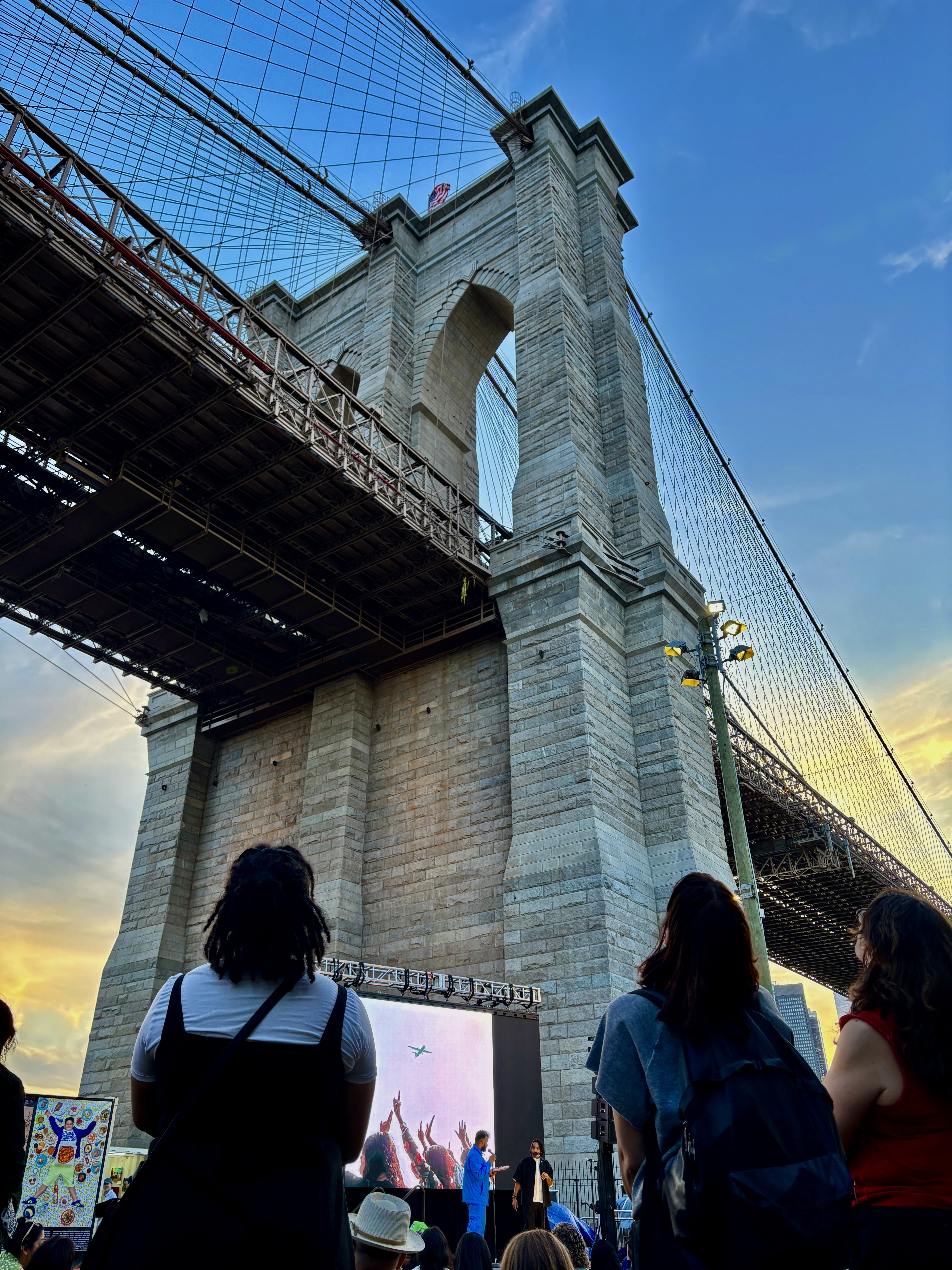 An image of the Brooklyn Bridge with a crowd at a photography festival